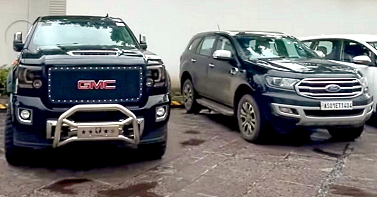 GMC Denali truck appears to be like big in entrance of Ford Endeavour SUV