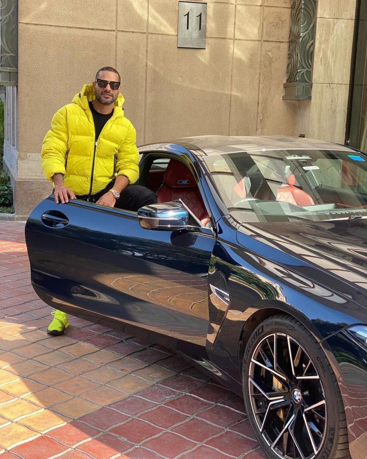Indian cricketer Shikhar Dhawan poses with his new BMW M8 Coupe worth over Rs. 2 crore