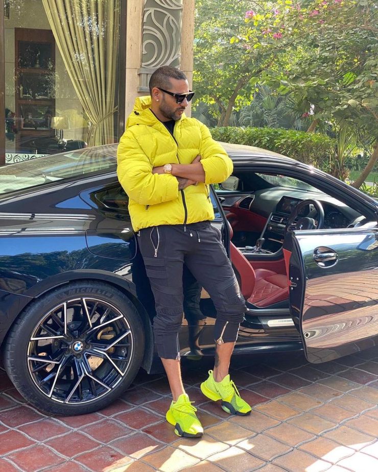 Indian cricketer Shikhar Dhawan poses with his new BMW M8 Coupe worth over Rs. 2 crore