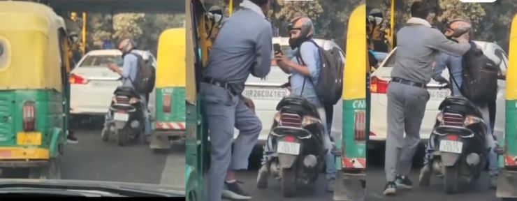 バイカーが乱暴に運転された自動車の写真を撮る: 自動車の運転手がバイカーを殴る [Video]