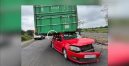 Container truck falls on top of Volkswagen Polo: Occupants escape unhurt