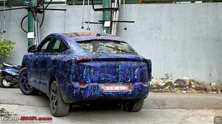 Mahindra XUV.e9 Electric Coupe SUV Spotted At A Charging Station: Spy Images