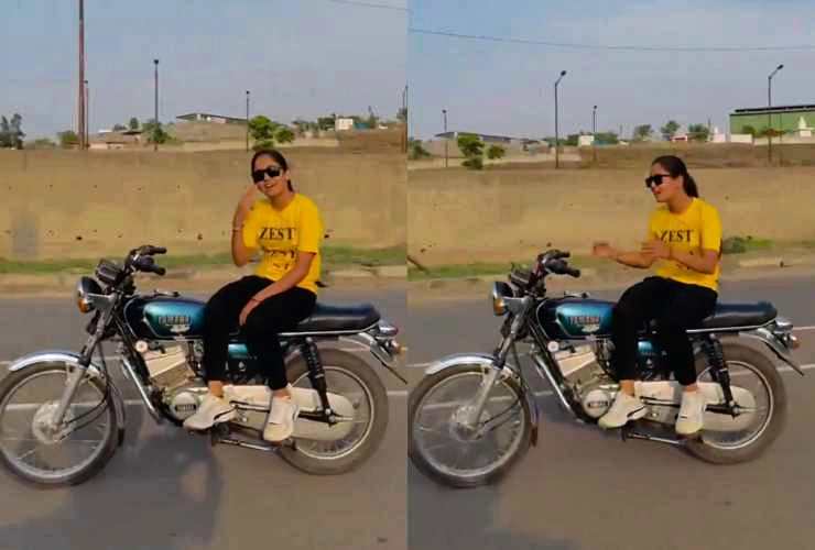 girl stunting on Yamaha RX100