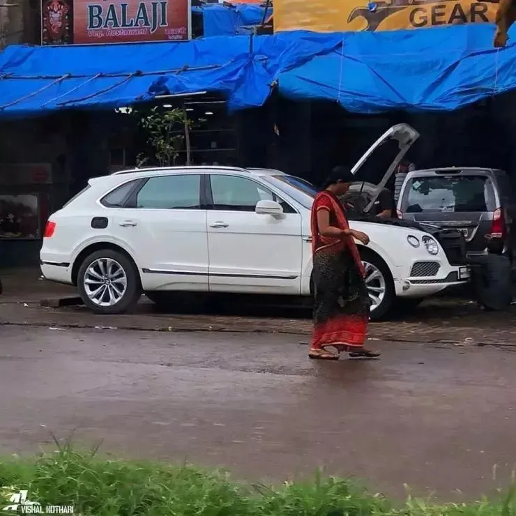 Bentley getting repaired at roadside workshop